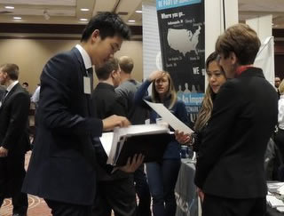 Photo of male students in business suits